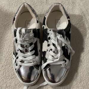 Trendy Black and White Sneakers with Silver Accents